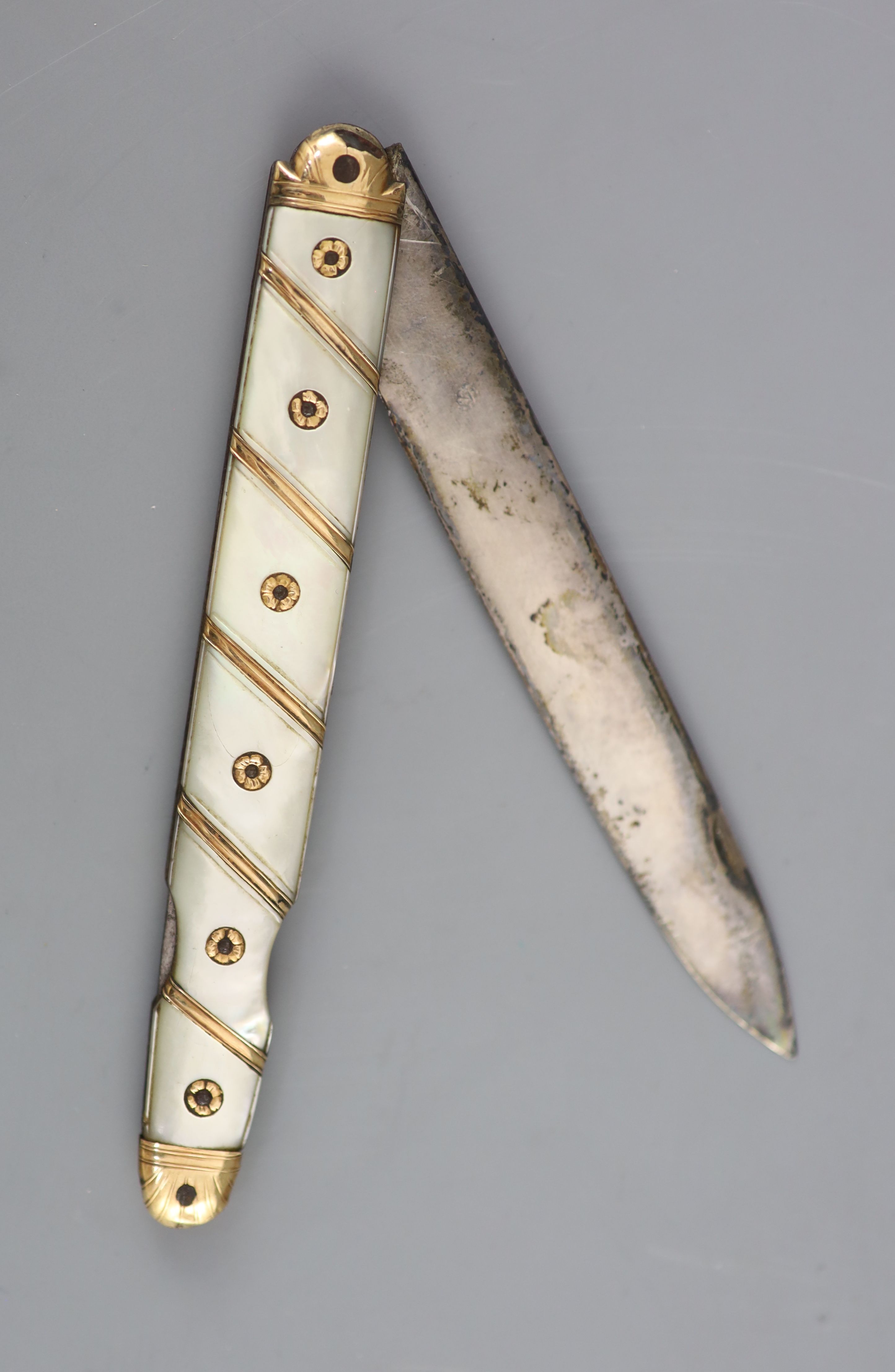 An early 19th century French? gold overlaid and mother of pearl mounted handled fruit/pocket knife,